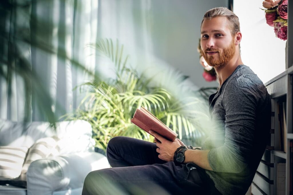 happy-man-holding-book